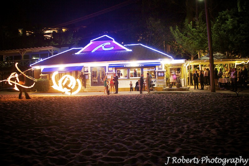 Fire throwers outside Le Kiosk Shelley Beach wedding reception - wedding photography sydney